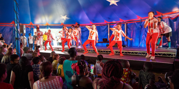 Dancers whearing red and white outfits at Walthamstow Garden Party